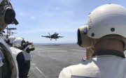 Philippine generals and journalists watch from the deck of the US aircraft carrier Theodore Roosevelt as a US fighter jet lands on Tuesday, in international waters off South China Sea. Photo: AP Philippine generals and journalists watch from the deck of the US aircraft carrier Theodore Roosevelt as a US fighter jet lands on Tuesday, in international waters off South China Sea. Photo: AP