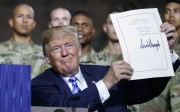 US President Donald Trump during a signing ceremony August 13 for the defence bill that expanded the powers of the inter-agency Committee on Foreign Investment in the United States. Photo: AP