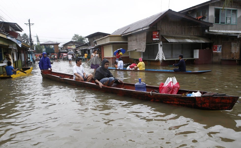 Thousands flee homes in Philippines to escape heavy rains and flood ...