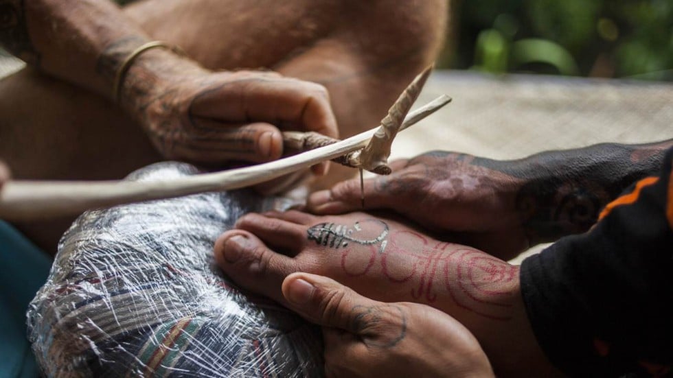Indonesian tattooists revive tribal traditions by tapping Indonesian tattooists revive tribal traditions by tapping