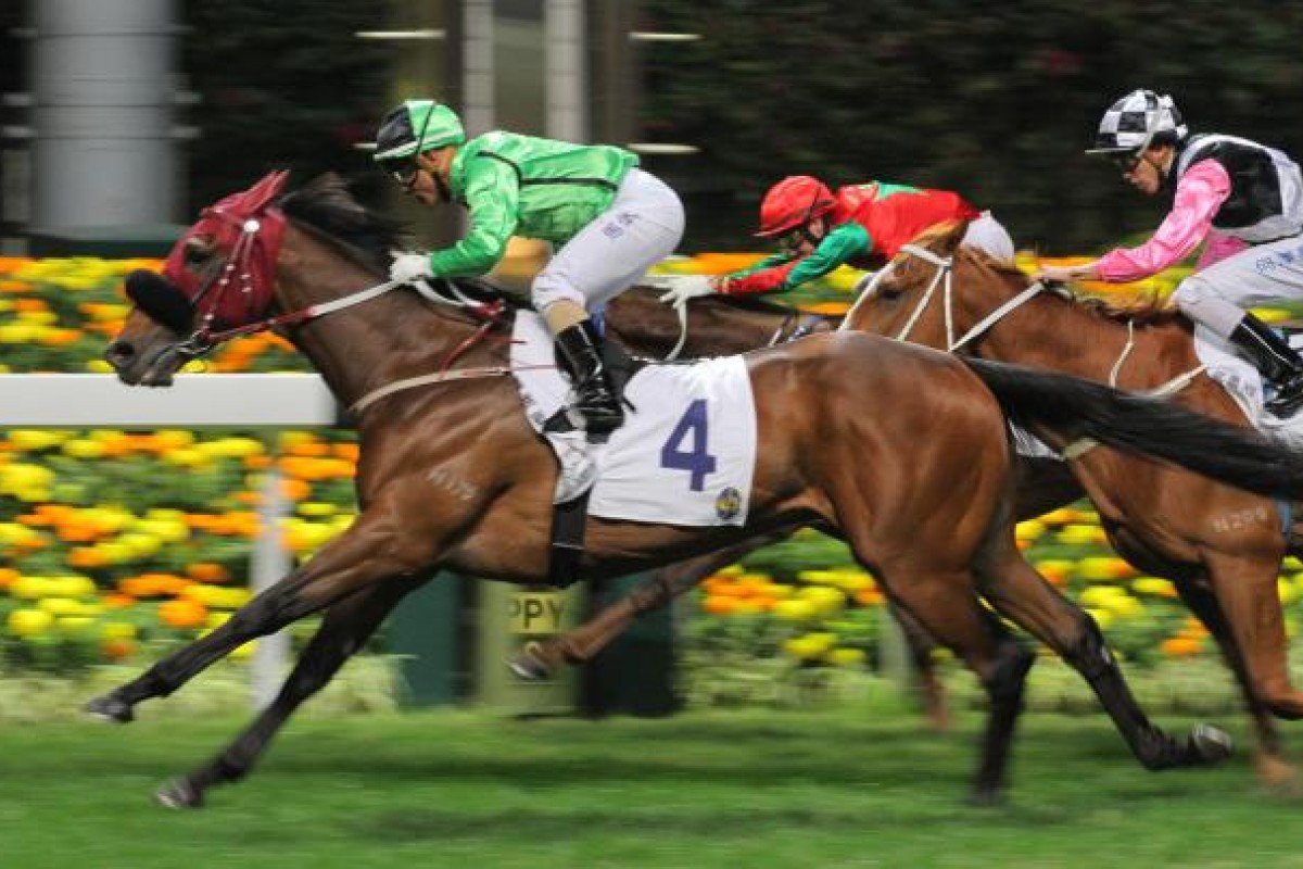 Weichong Marwing powers Military Attack over the line to win last night's Group Three January Cup at Happy Valley. Photo: Kenneth Chan