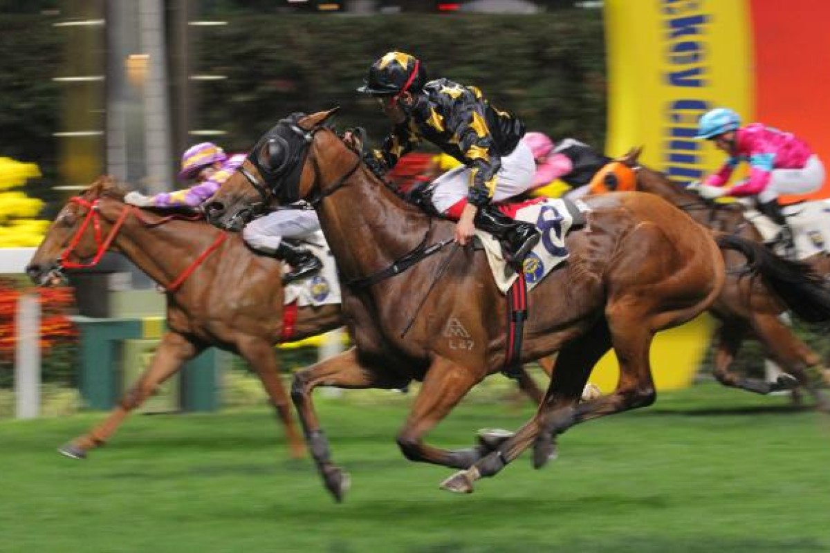 Richard Fourie guides Tom's Eighth home for a come-from-behind win to complete a double for him and Tony Millard. Photo: Kenneth Chan