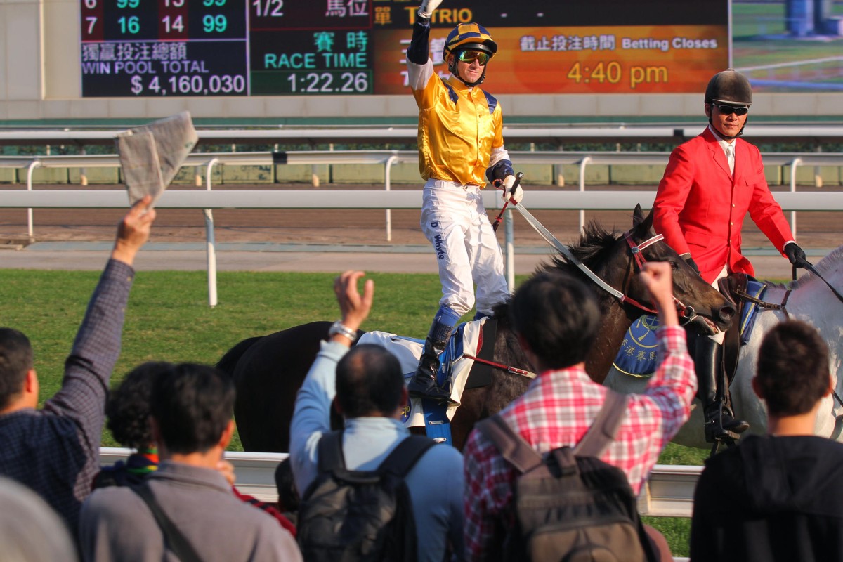 Douglas Whyte is cheered by the crowd as he brings Sterling City back to the winner's circle after his victory in the Chinese Club Challenge Cup. Photo: Kenneth Chan