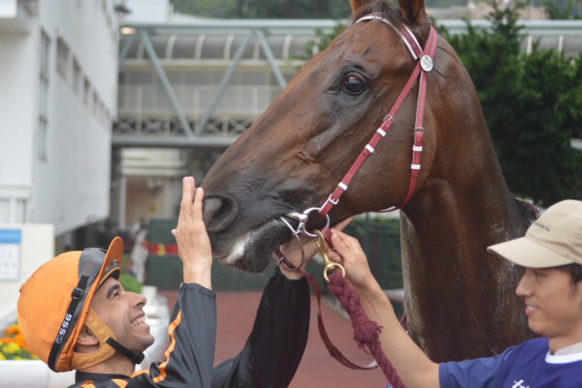 Joao Moreira gives Able Friend a pat after the pair combined to win the Queen's Silver Jubilee Cup. Photo: Andrew Hawkins