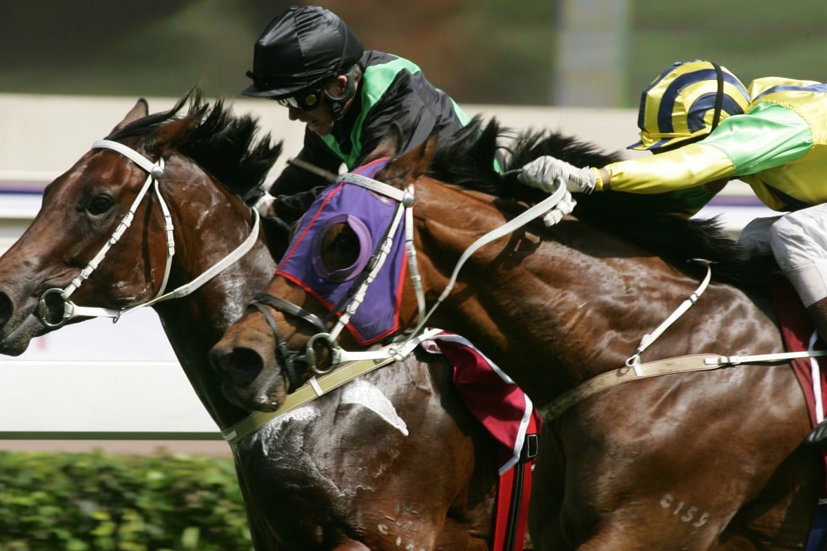 Bullish Luck and jockey Gerald Mosse swoop on hot favourite Silent Witness (Felix Coetzee) in the 2005 Champions Mile. Photos: Kenneth Chan