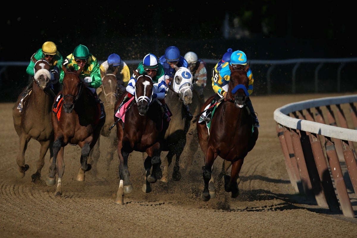 Victor Espinoza cuddles American Pharoah on his way to winning the Belmont Stakes, becoming the first horse since Affirmed in 1978 to win the Triple Crown. Photo: Reuters