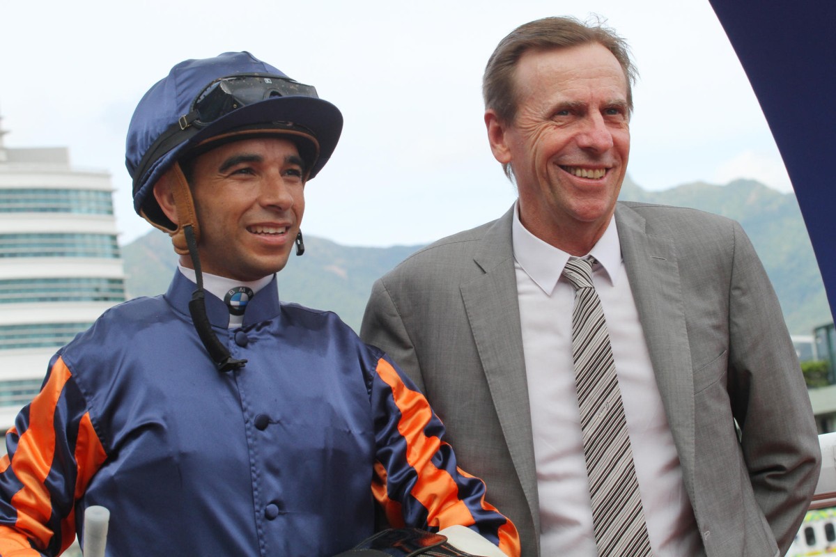 Joao Moreira (left) will be trying to win the Queen Anne Stakes for John Moore on Tuesday, but on Sunday he was advancing the championship hopes of John Size (right) with a double for the trainer. Size won three races, as did Moore. Photo: Kenneth Chan