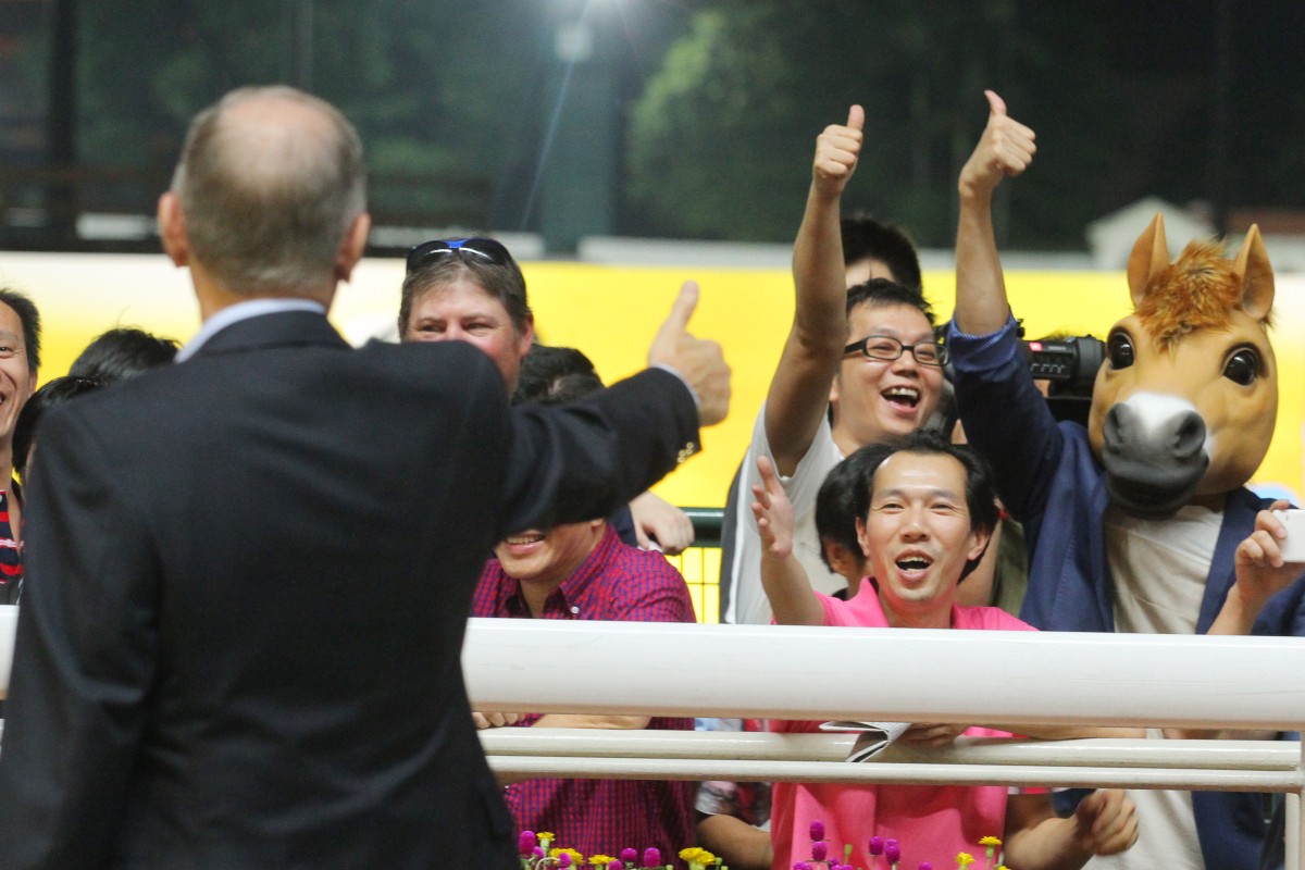 John Moore gets the thumbs up from some happy punters after Happy Meteor put the trainers' title to bed. Photos: Kenneth Chan