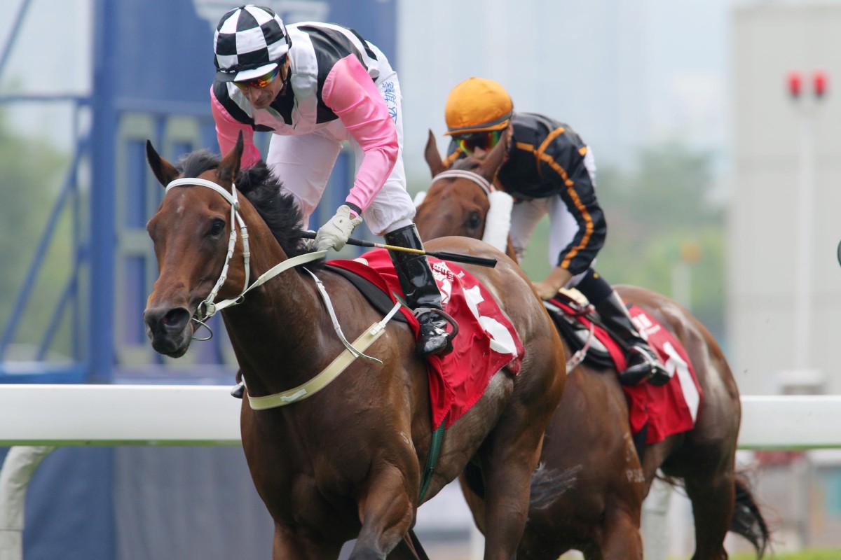 Beauty Flame (Gerald Mosse) wins the Jockey Club Mile comfortably, with hot favourite Able Friend (Joao Moreira) running on for third along the rail. Photo: Kenneth Chan