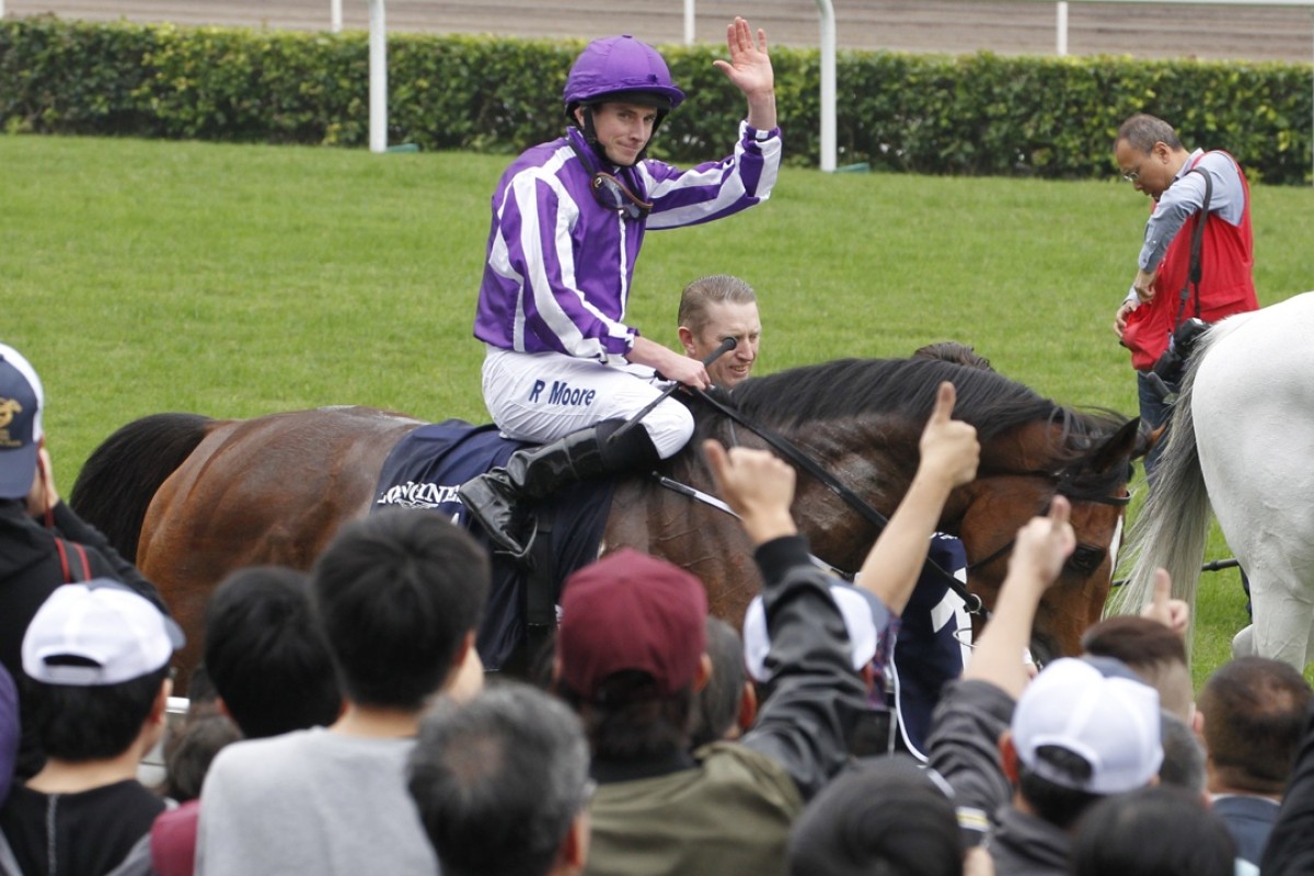 The crowd congratulates Ryan Moore after his win on Highland Reel. Photos: Kenneth Chan