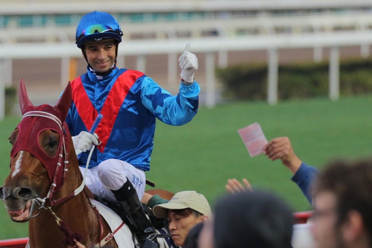 Joao Moreira celebrates with the crowd after making it a treble on Rapper Dragon. Photo: Kenneth Chan