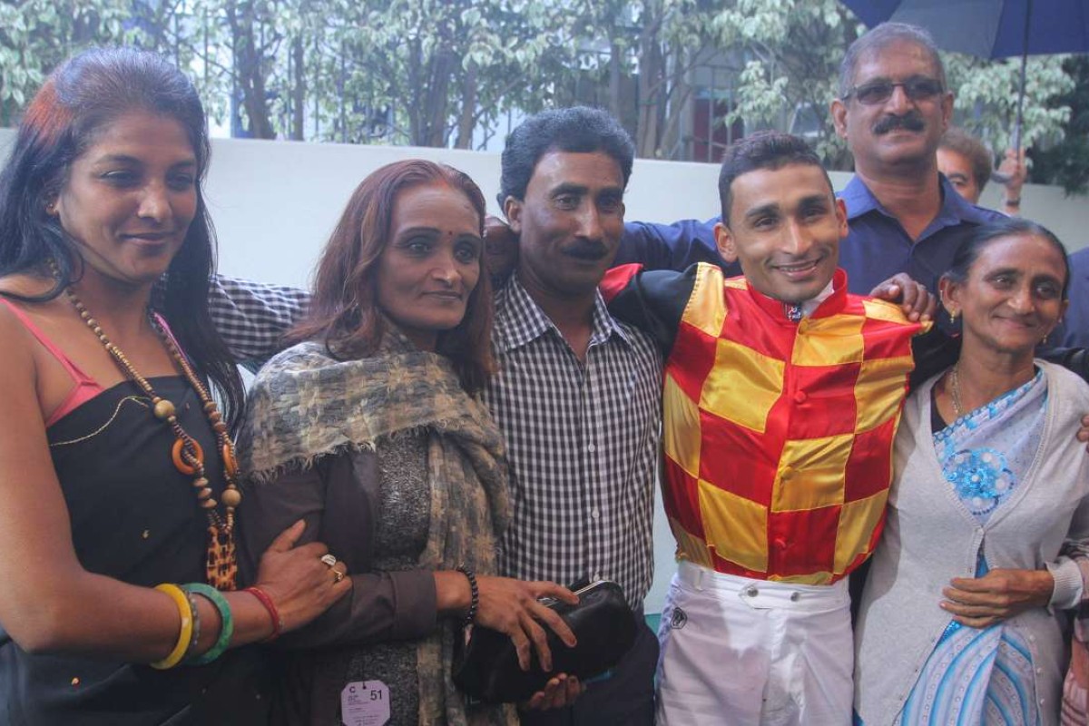 Karis Teetan with his family after winning aboard Royale Elegance in the Singapore Turf Club Trophy at Sha Tin. Photos: Kenneth Chan