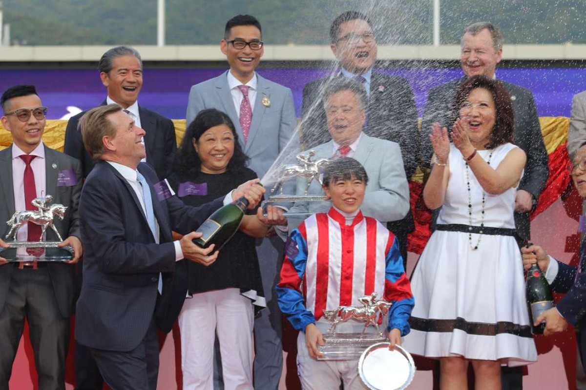 John Size celebrates after clinching the trainers’ championship. Photo: Kenneth Chan