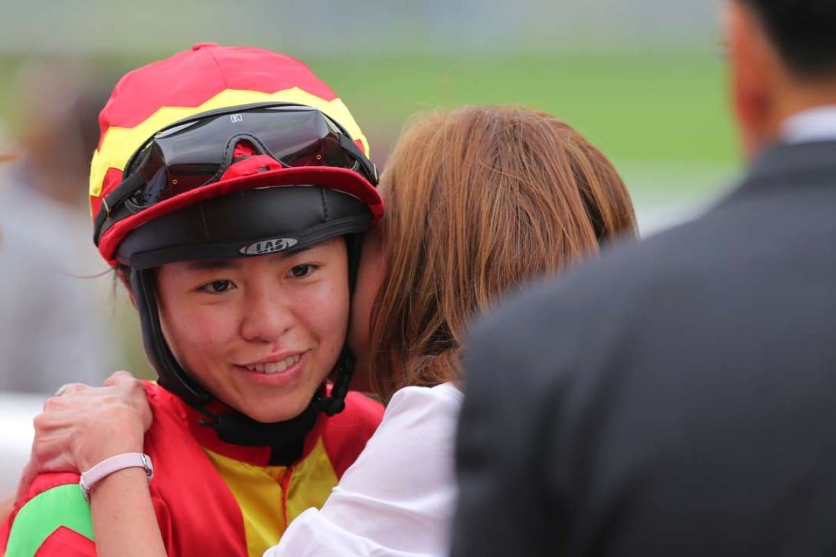 Kei Chiong receives a hug after her bizarre day culminates in a win on Multimax. Photo: Kenneth Chan