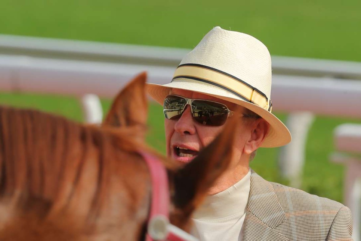 John Moore looks over Dragon Harmony after his win at Sha Tin on Sunday. Photos: Kenneth Chan
