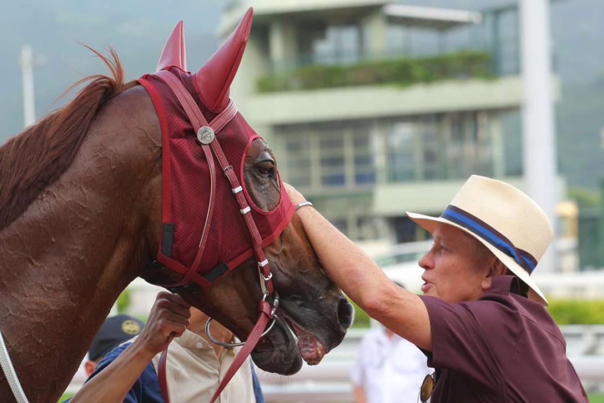 John Moore gives Rapper Dragon a pat after a Group Three win in May and the Australian import is his first choice of the seven runners he has in Sunday’s Hong Kong Classic Mile. Photos: Kenneth Chan