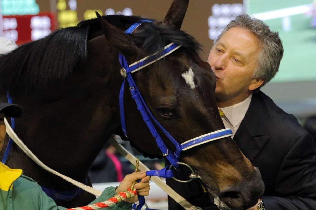 David Ferraris gives Nitro Express a kiss after winning at Happy Valley on Wednesday night. Photos: Kenneth Chan