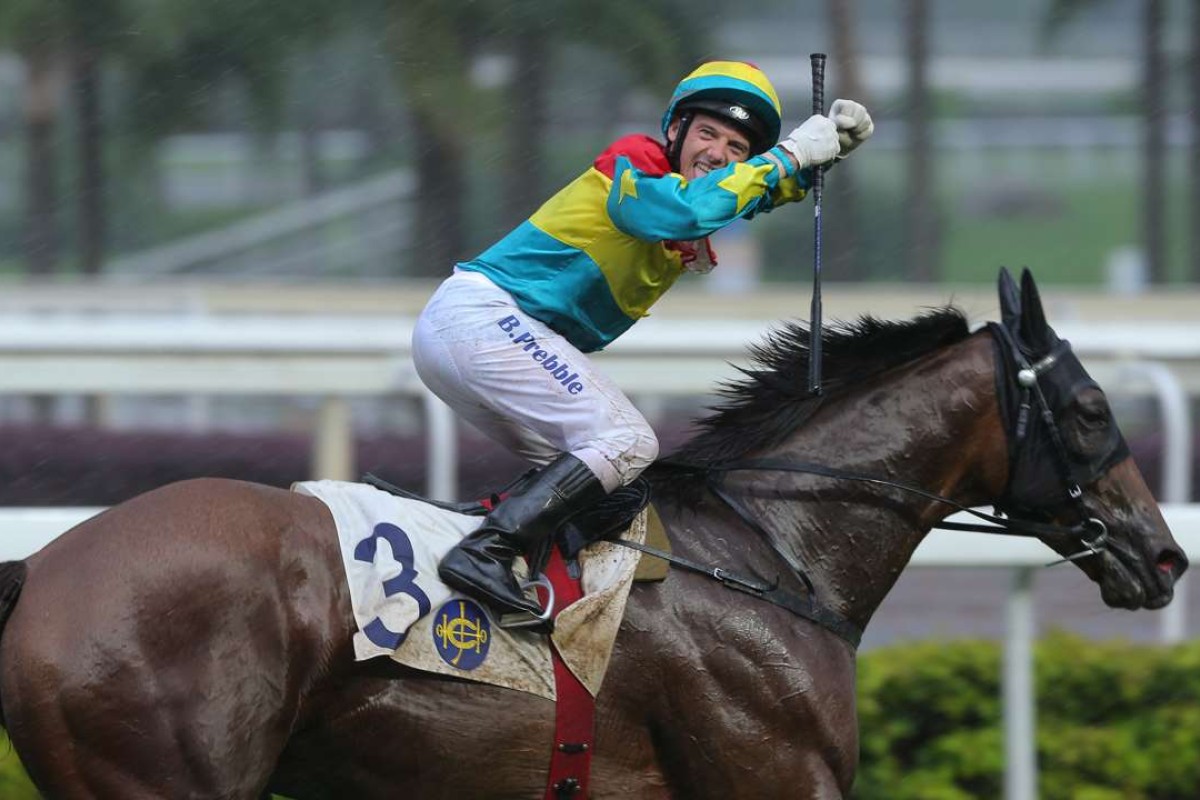Brett Prebble celebrates a win aboard Solar Hei Hei. Photos: Kenneth Chan