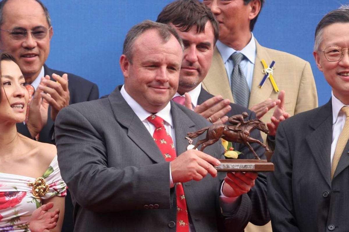 Mike de Kock collects his trophy for winning the Audemars Piquet QE II Cup with Irridescence in 2006. Photos: Kenneth Chan