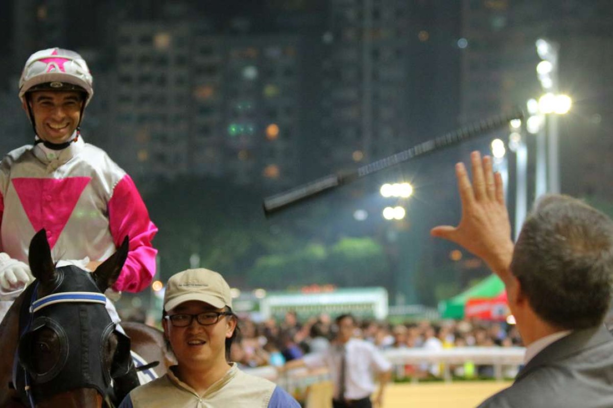 Joao Moreira throws his whip to trainer Caspar Fownes after Sweet Bean gives them another winner at Happy Valley. Moreira and Fownes have combined 37 times this season for 16 wins – a profit of nearly 54 per cent. Photos: Kenneth Chan