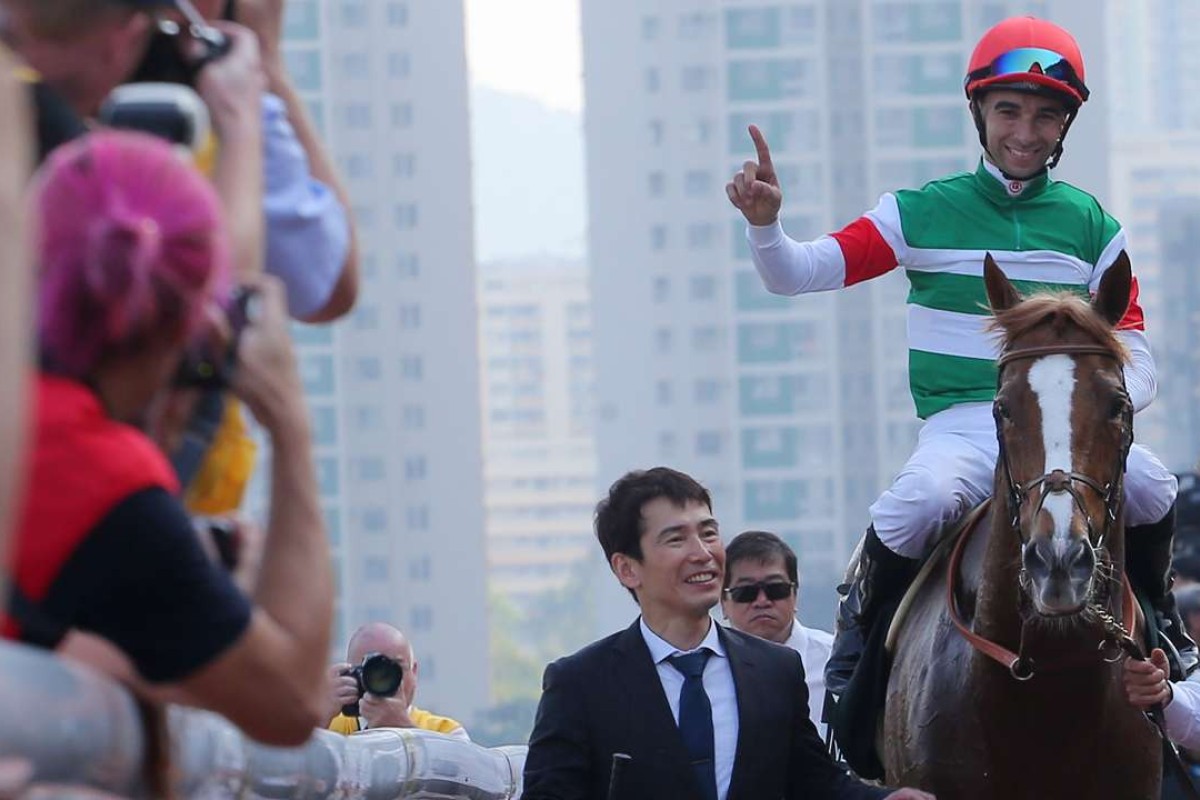 Joao Moreira salutes the crowd after his win on Neorealism in the QE II Cup. Photos: Kenneth Chan