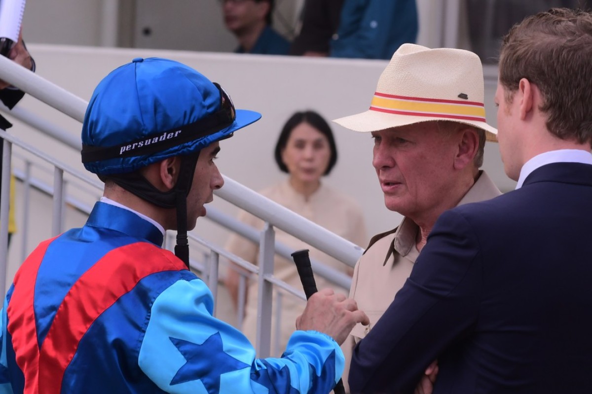 Trainer John Moore (second right) talking with Joao Moreira. Photos: Kenneth Chan
