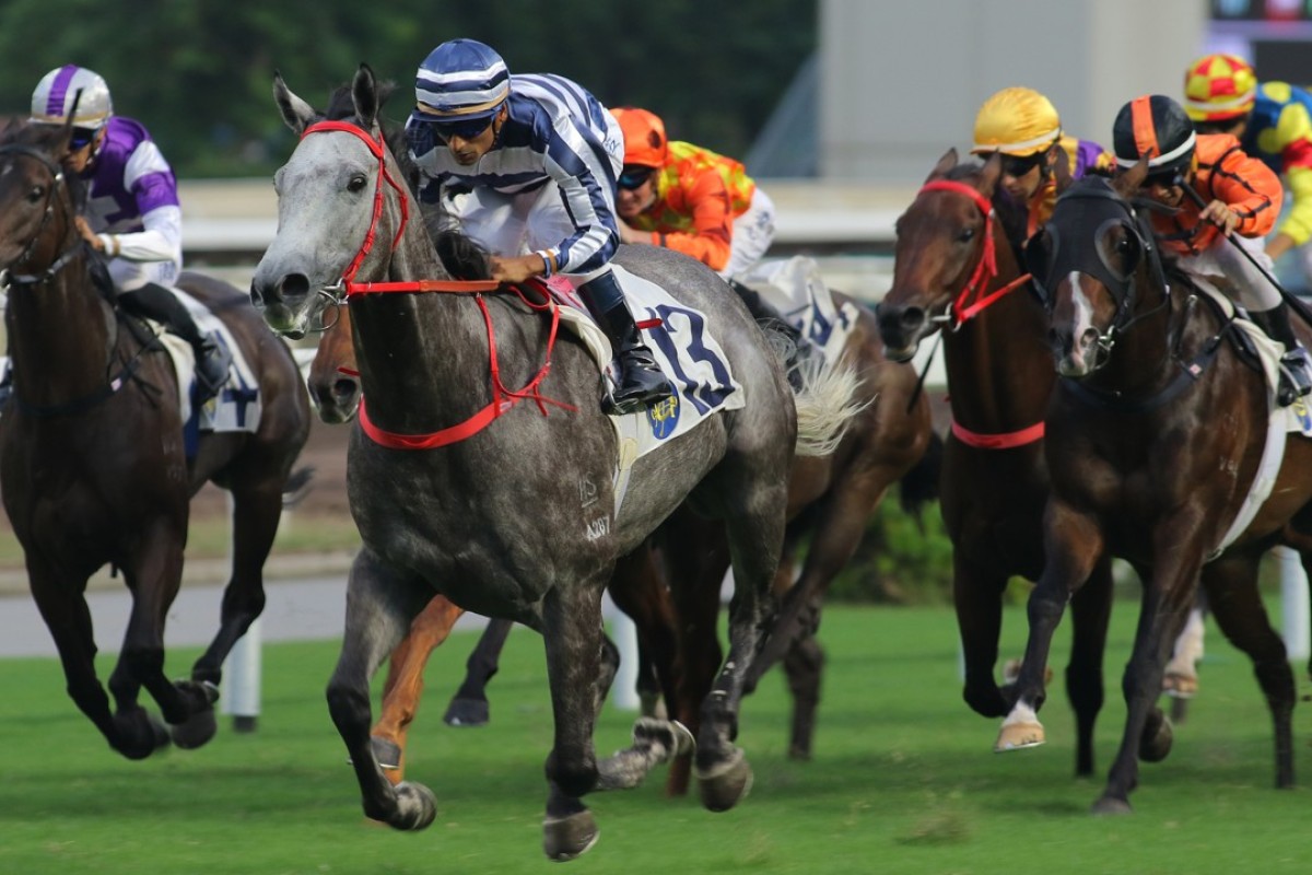 Karis Teetan gets out of trouble to guide talented grey Fifty Fifty to victory at Sha Tin on Sunday. Photos: Kenneth Chan