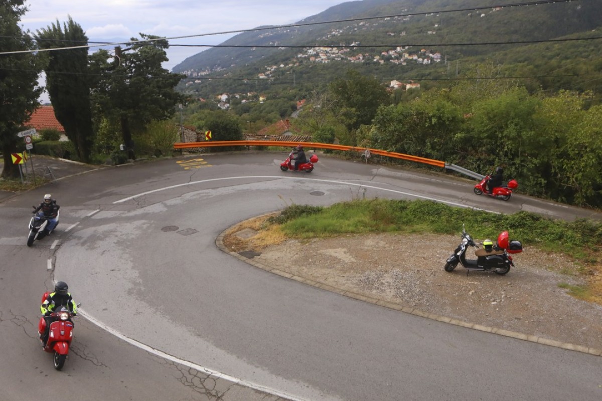 An Edelweiss Bike Travel tour party on Vespa 300GTSs ascend above Opatija, Croatia. Pictures: Christopher P. Baker