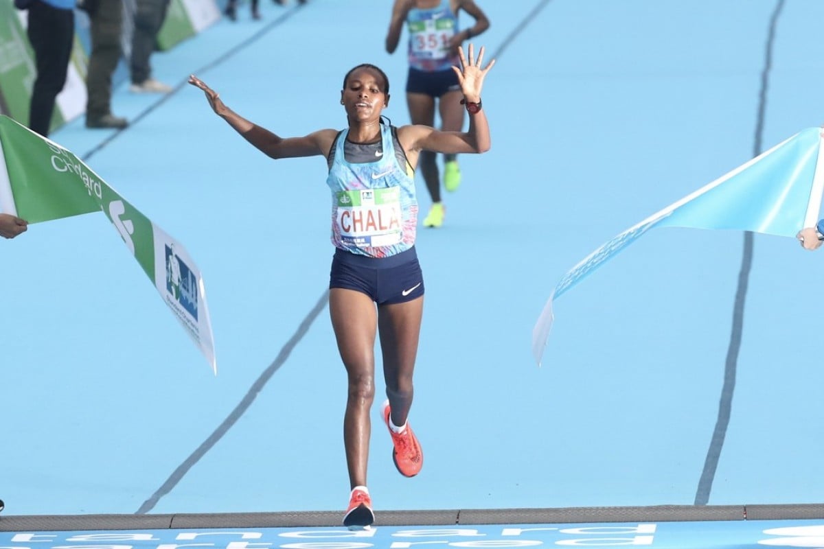 Gulume Tollesa Chala crosses the finish line to win the women’s Hong Kong Marathon. Photo: Nora Tam