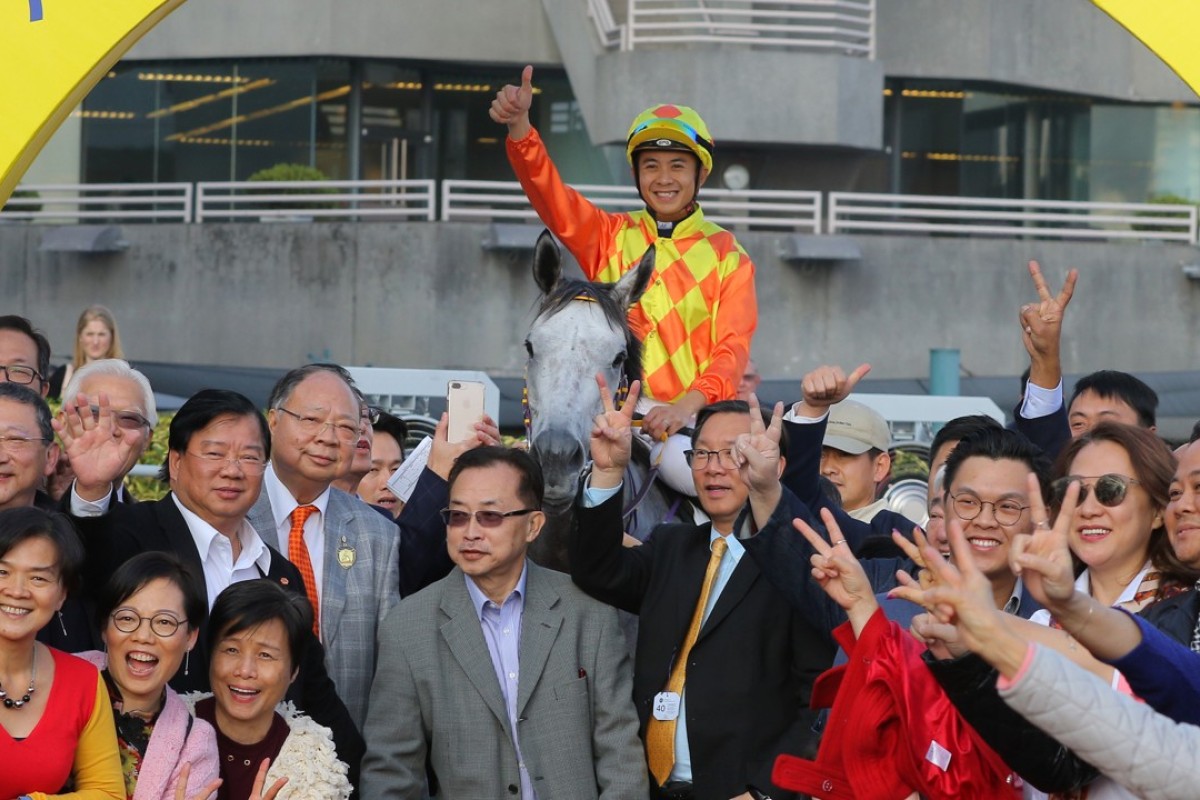 Derek Leung celebrates with owners after winning a Class Two last month on Pingwu Spark. Photos: Kenneth Chan