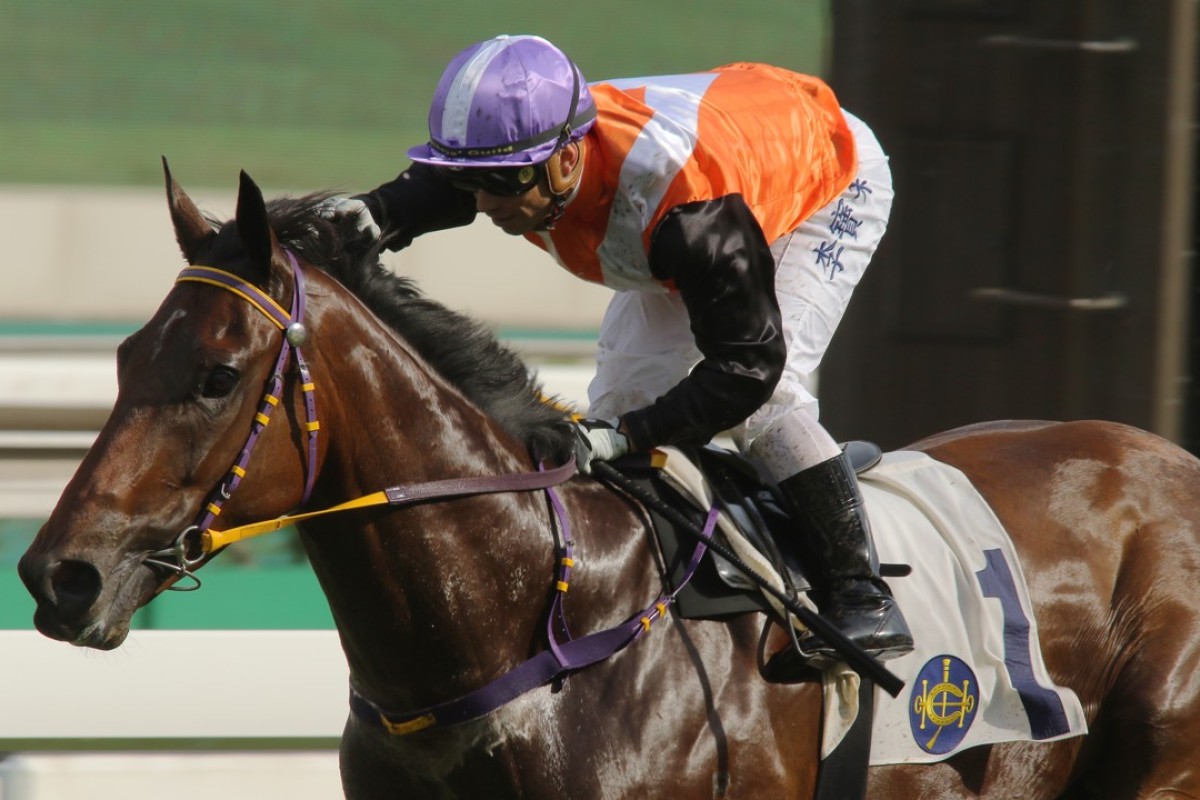 Umberto Rispoli gives Cruising a pat after winning at Sha Tin on Sunday. Photos: Kenneth Chan