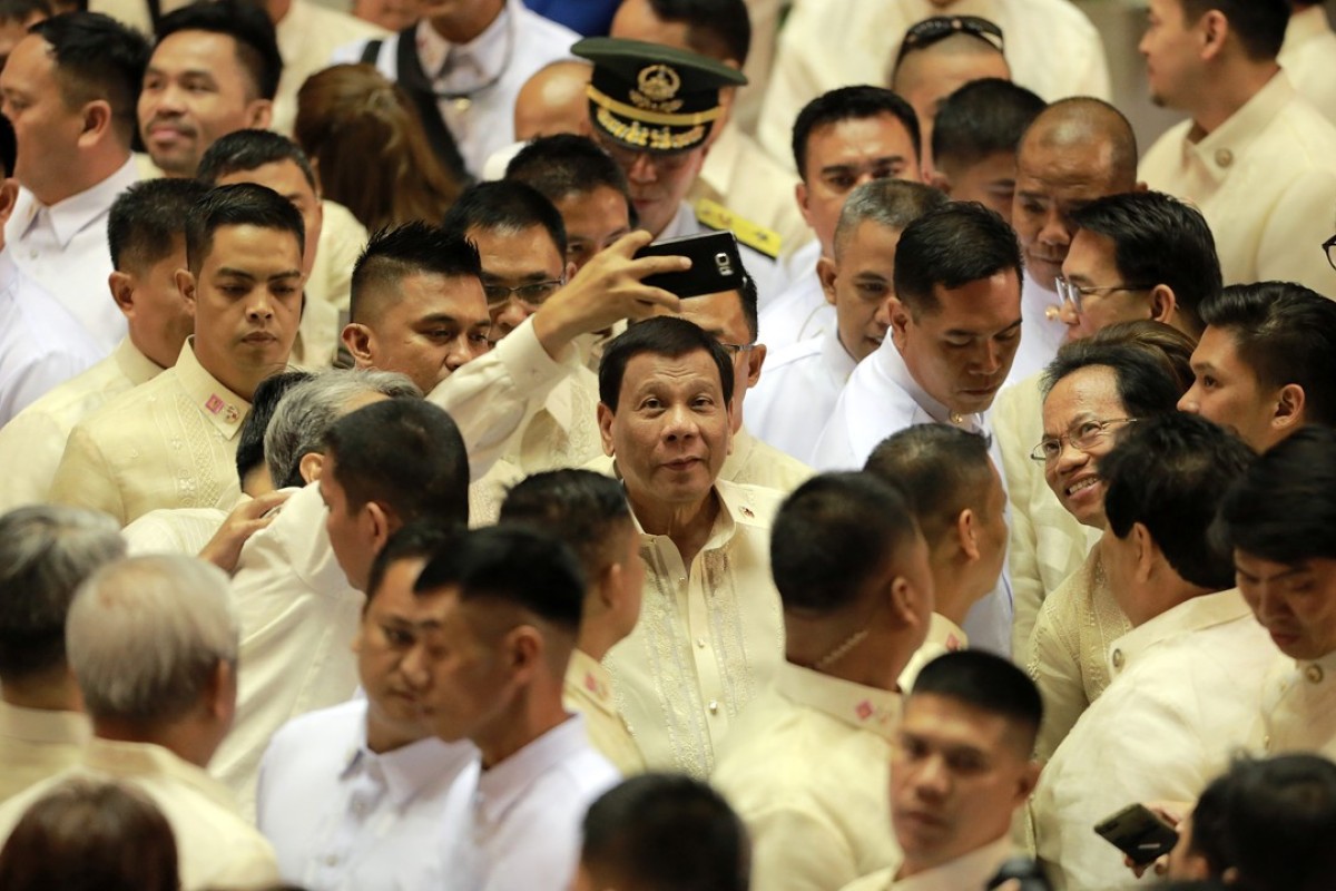 Philippine President Rodrigo Duterte, cetnre, is seen after delivering his third State of the Nation Address. Photo: Xinhua