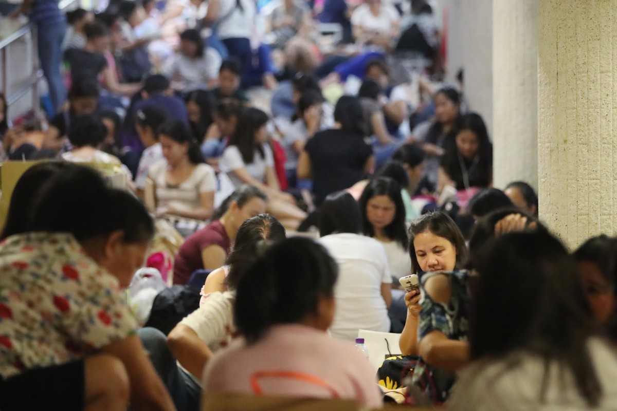 Domestic workers gather in Central on a public holiday. Photo: Edward Wong