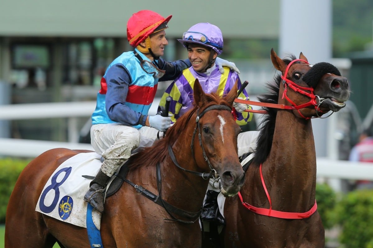 Jockeys Douglas Whyte and Joao Moreira share a moment after the Brazilian’s last race in Hong Kong. Photos: Kenneth Chan