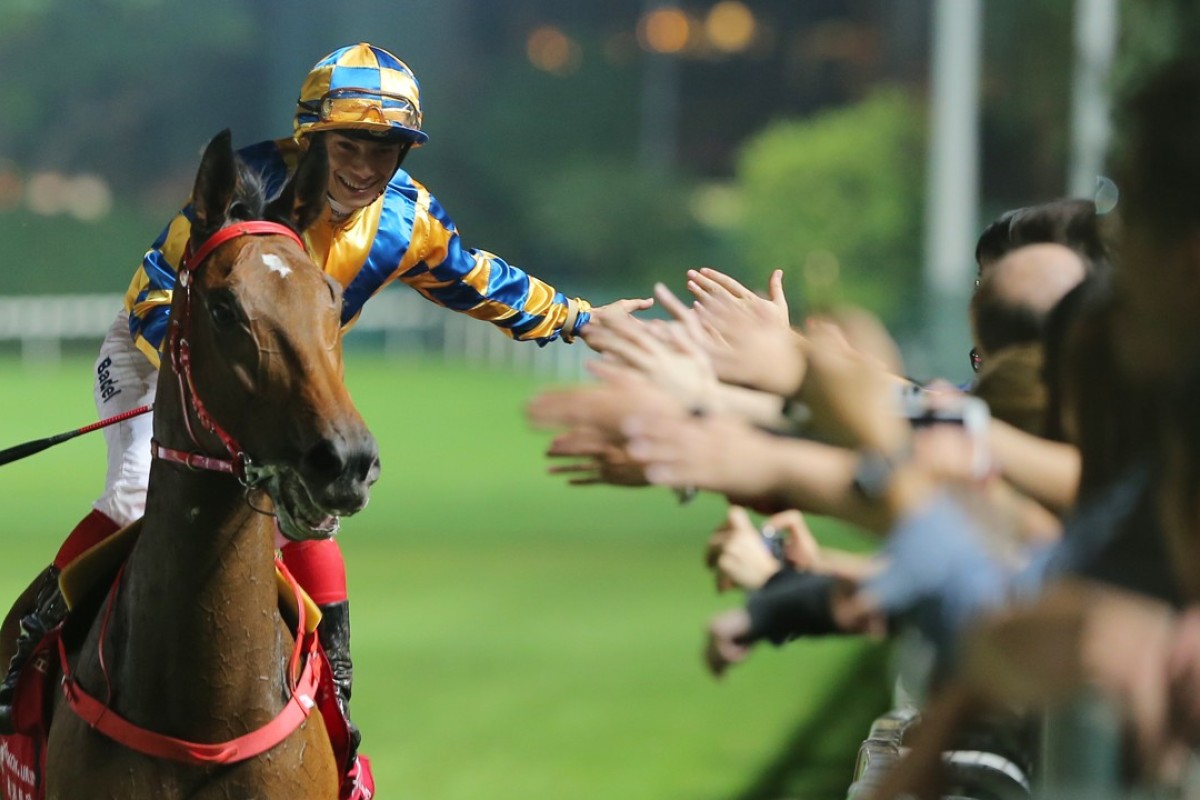 Alexis Badel celebrates a winner with the Happy Valley crowd. Photos: Kenneth Chan