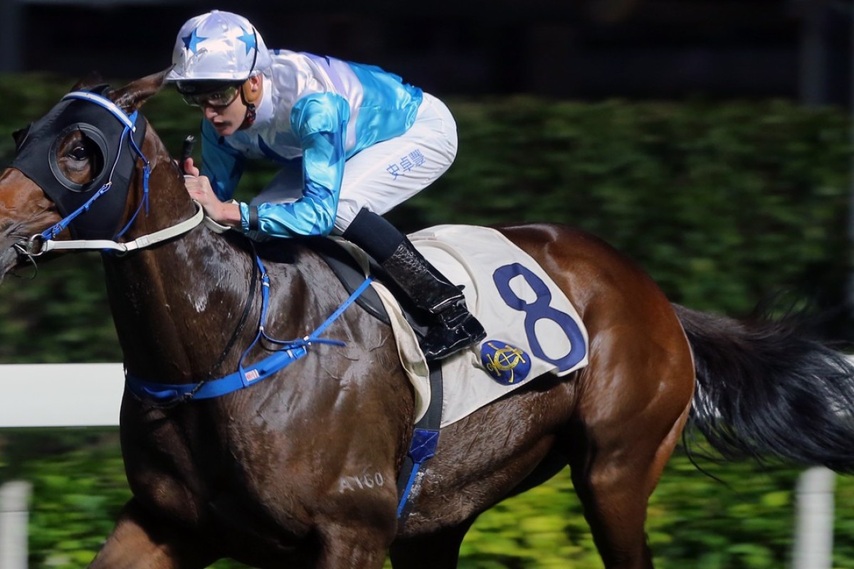 Chad Schofield pushes Smart Baby to victory at Happy Valley on Wednesday night. Photos: Kenneth Chan