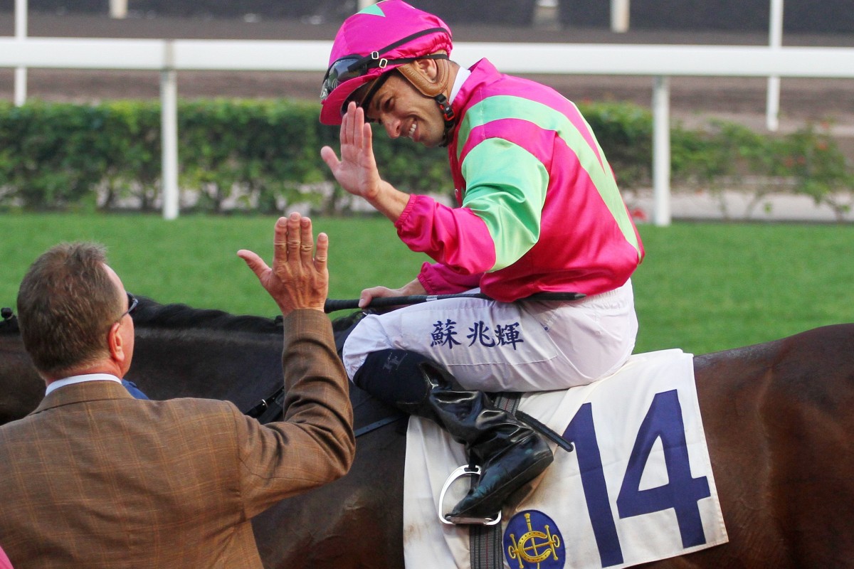 Jockey Silvestre de Sousa and Tony Millard share a high-five after Elusive State’s win at Sha Tin on Saturday. Photos: Kenneth Chan