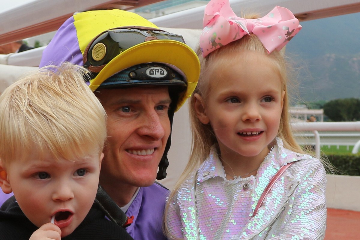 Jockey Zac Purton smiles for the cameras with his two children Cash (left) and Roxy (right) after winning on Time To Celebrate at Sha Tin on Sunday. Photos: Kenneth Chan