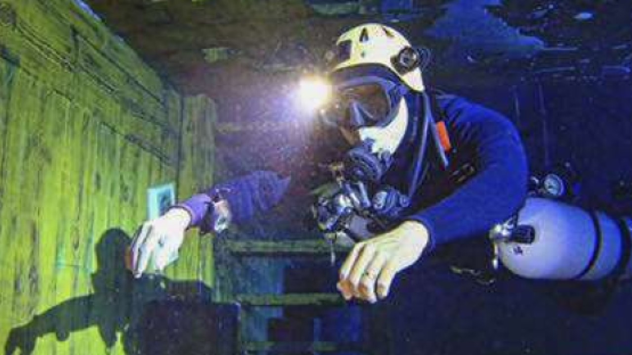 A participant diving in the pool at the Divecube Hotel.